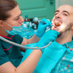 man gets dental cleaning