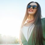 woman smiles in the sunlight