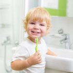 boy brushing his teeth