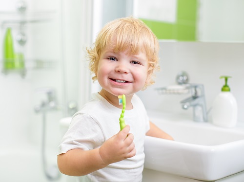 boy brushing his teeth